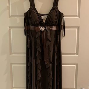 Brown satin ruffled cocktail dress with broach